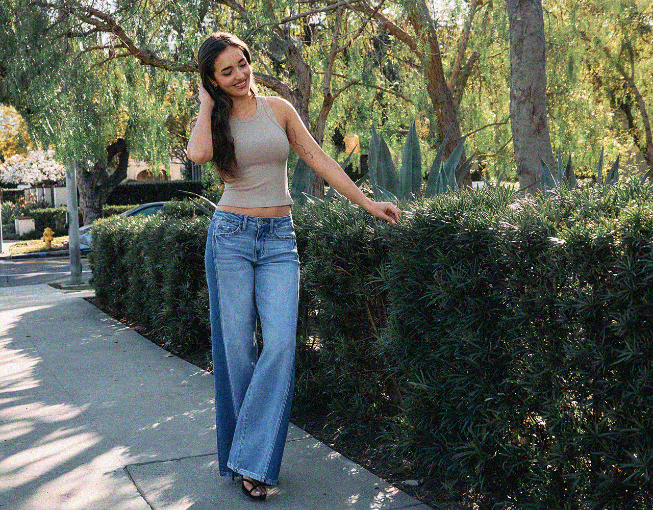 Two models wear Denim Day’s bestselling denim in a catalog-style lookbook, photographed residential settings.